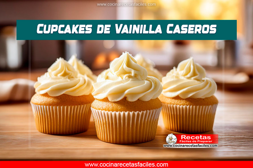 Imagen de cupcakes de vainilla recién horneados con buttercream decorada con almendras o zanahoria rallada.