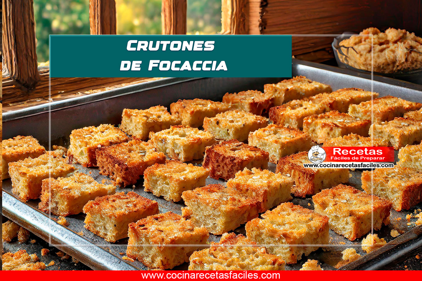 "Crutones de focaccia dorados y crujientes en una bandeja para hornear, espolvoreados con hierbas italianas y especias."