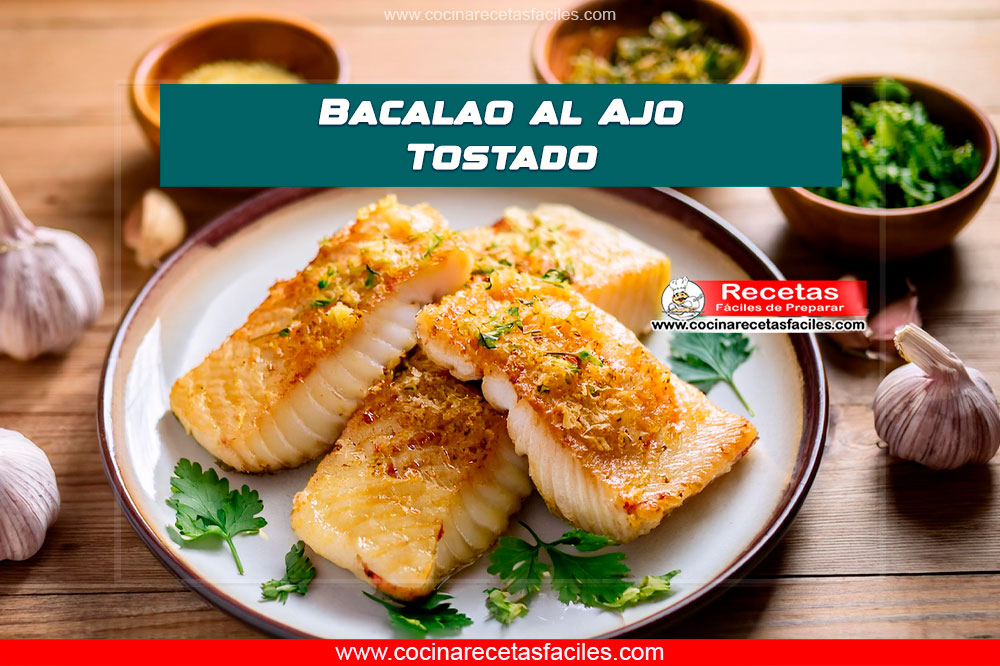 Bacalao al ajo tostado en un plato con perejil y limón