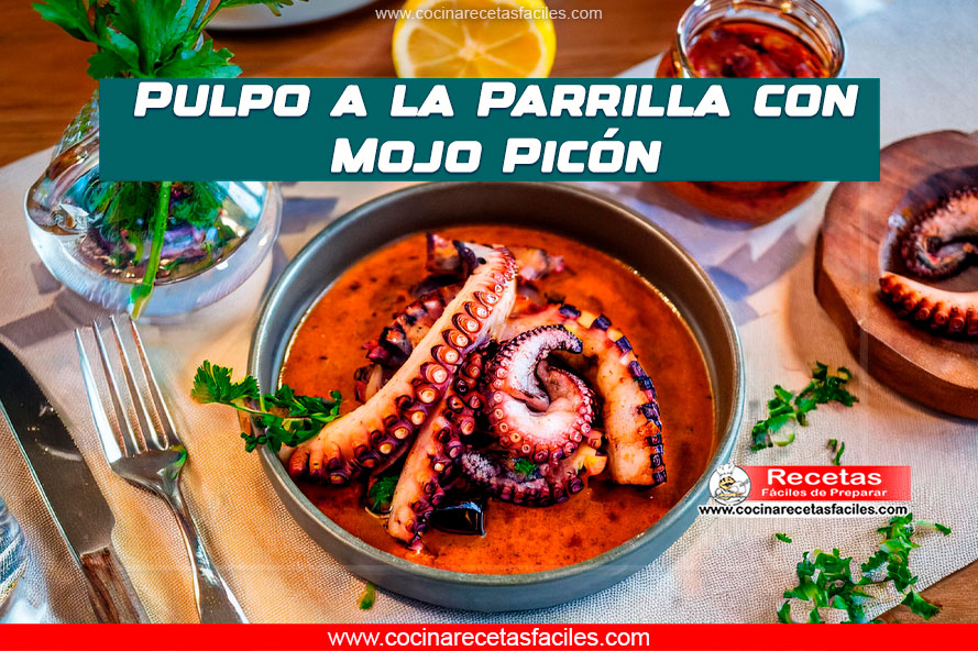 Pulpo a la parrilla con mojo picón servido en plato rústico.