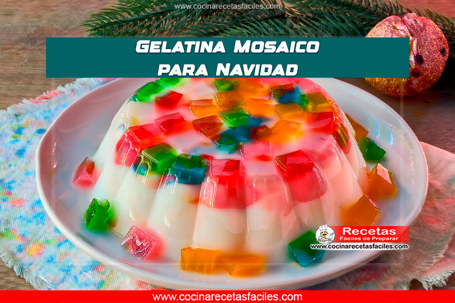 Gelatina mosaico navideña con frutas frescas y colores vibrantes, en una mesa de madera