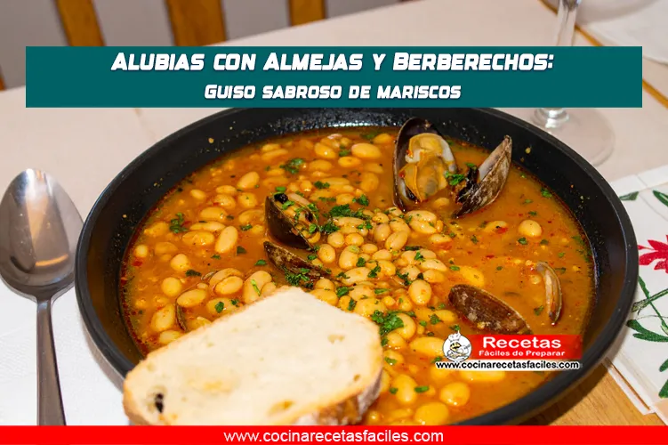 Alubias con almejas y berberechos servidas en caldo de mariscos, sobre una mesa de cocina con ventana.