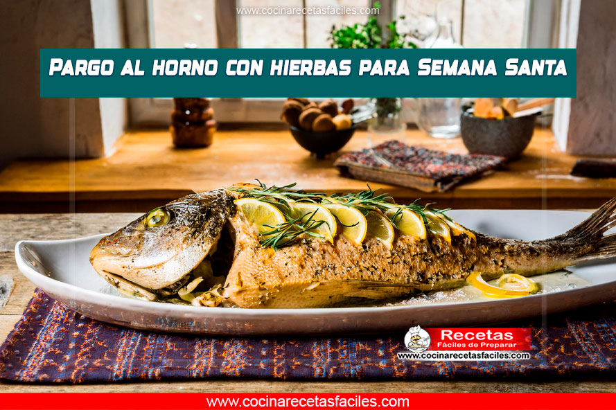 Pargo al horno con hierbas frescas y limón en una fuente.