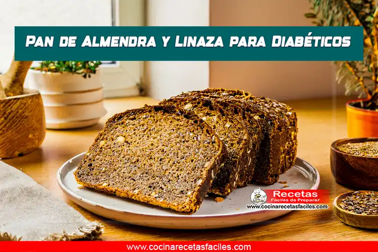 Pan de almendra y linaza recién horneado, con rebanadas cortadas, sobre una mesa de madera en una cocina iluminada